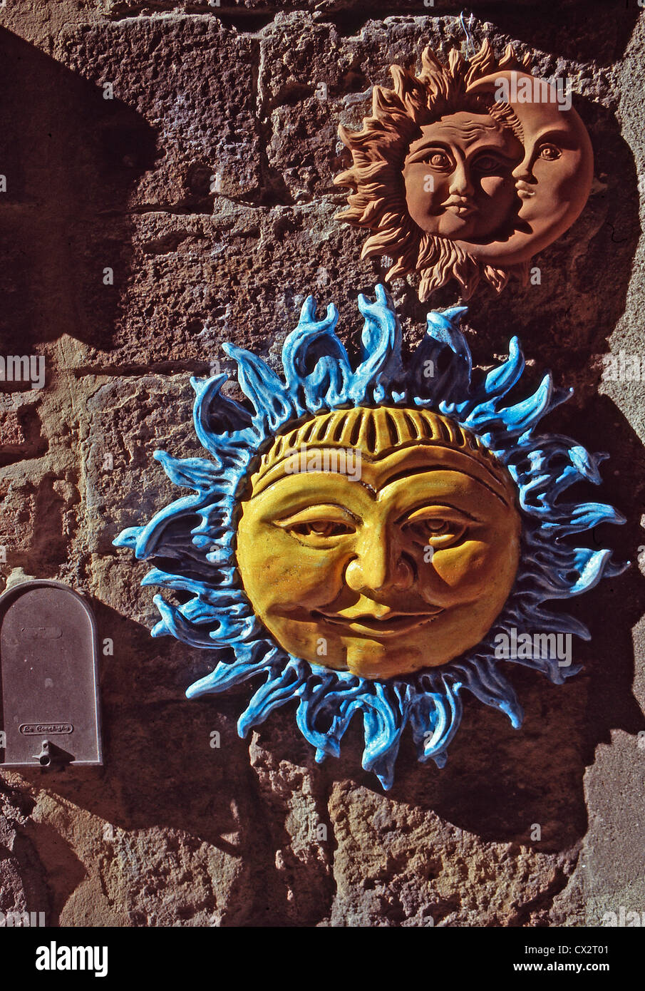 Decorative wall hangings on a wall in Volterra,Italy Stock Photo