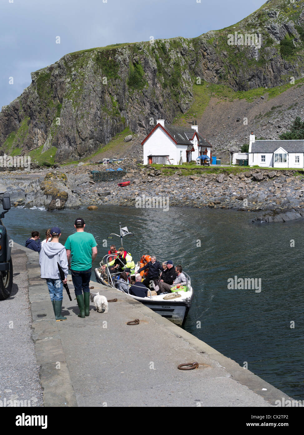 dh Easdale Islands ferry boat SEIL ISLAND ARGYLL People harbour jetty scottish highlands tourists Scotland holiday loading passenger Stock Photo