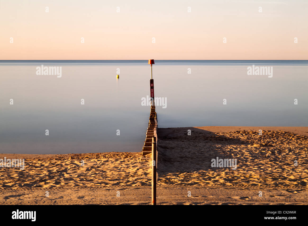 Looking straight down the Groyne at Bournemouth in the early part of the morning. Stock Photo