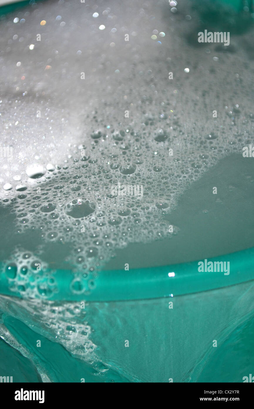 bucket overflowing with hot soapy water Stock Photo Alamy