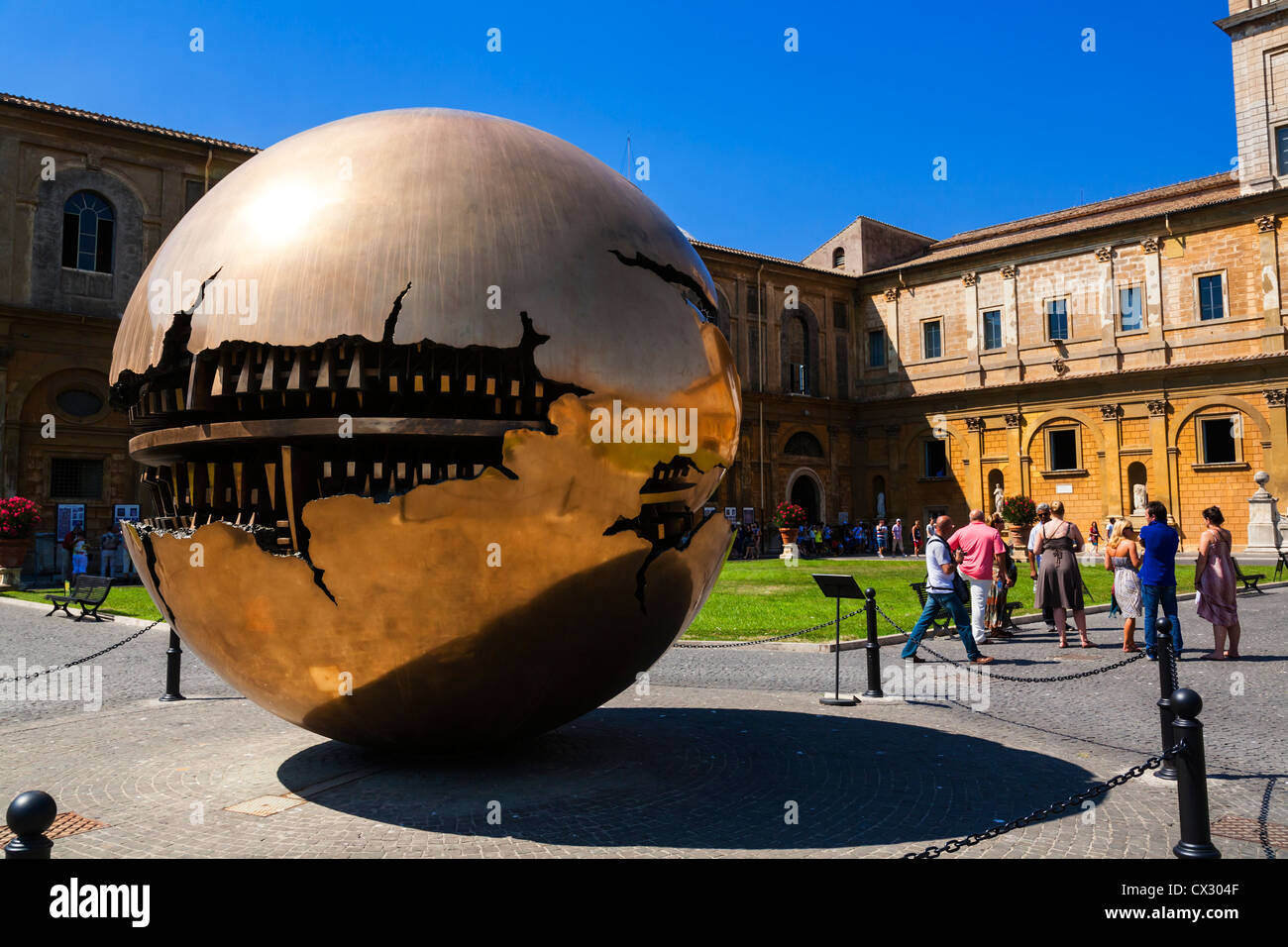 Sphere Within Sphere sculpture by Pomodoro in the Cortile della Pigna, Vatican Museum Gardens, Rome, Lazio, Italy. Stock Photo