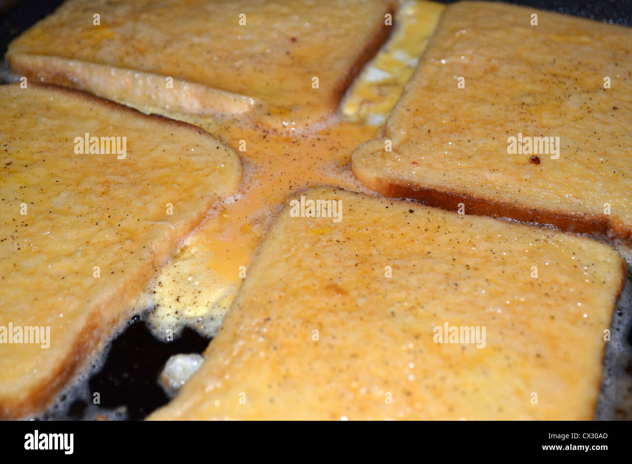 French toast or eggy bread cooking in frypan Stock Photo Alamy
