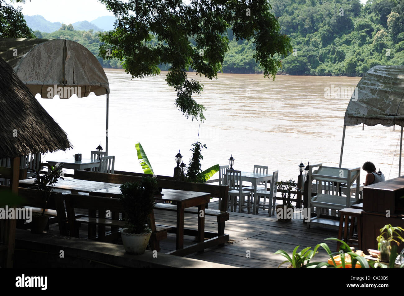 Restaurant overlooking the Mekong River, Laos. Stock Photo