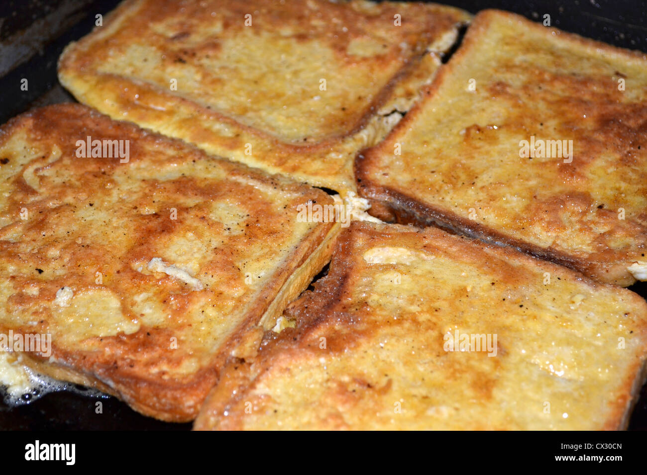 French toast or eggy bread cooking in frypan Stock Photo Alamy