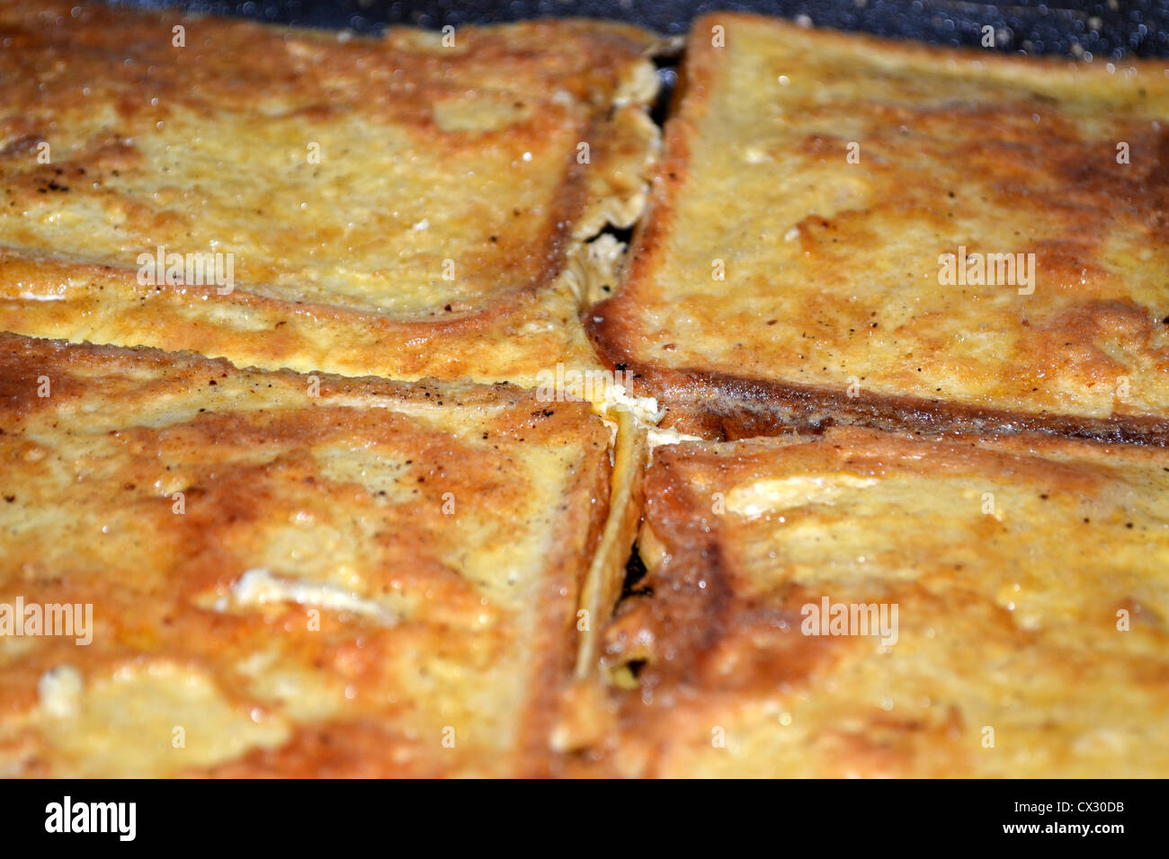 French toast or eggy bread cooking in frypan Stock Photo Alamy