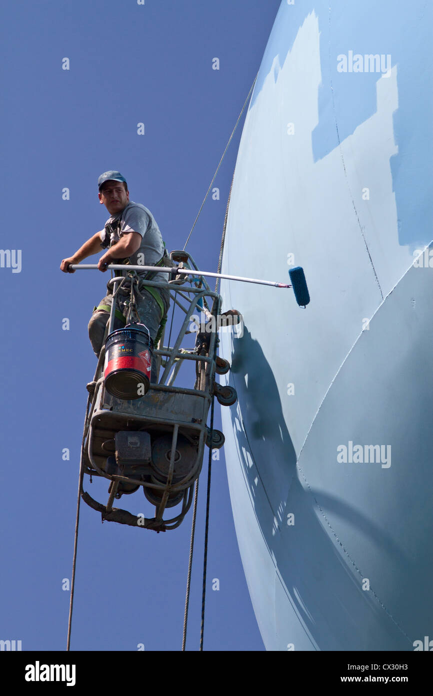 Water tower being repaired and painted Stock Photo