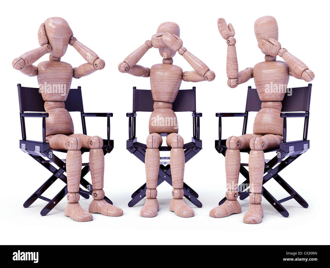 Three wooden dolls sitting doing bodily gestures. Concept of the three wise monkeys. Stock Photo
