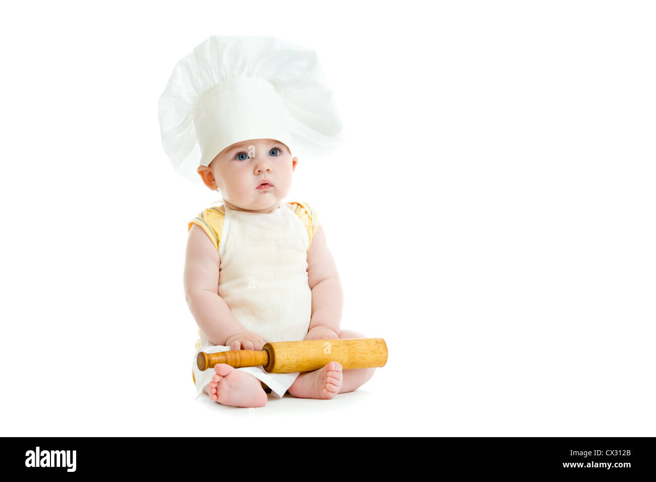 Little boy with rolling pin and cook hat isolated Stock Photo