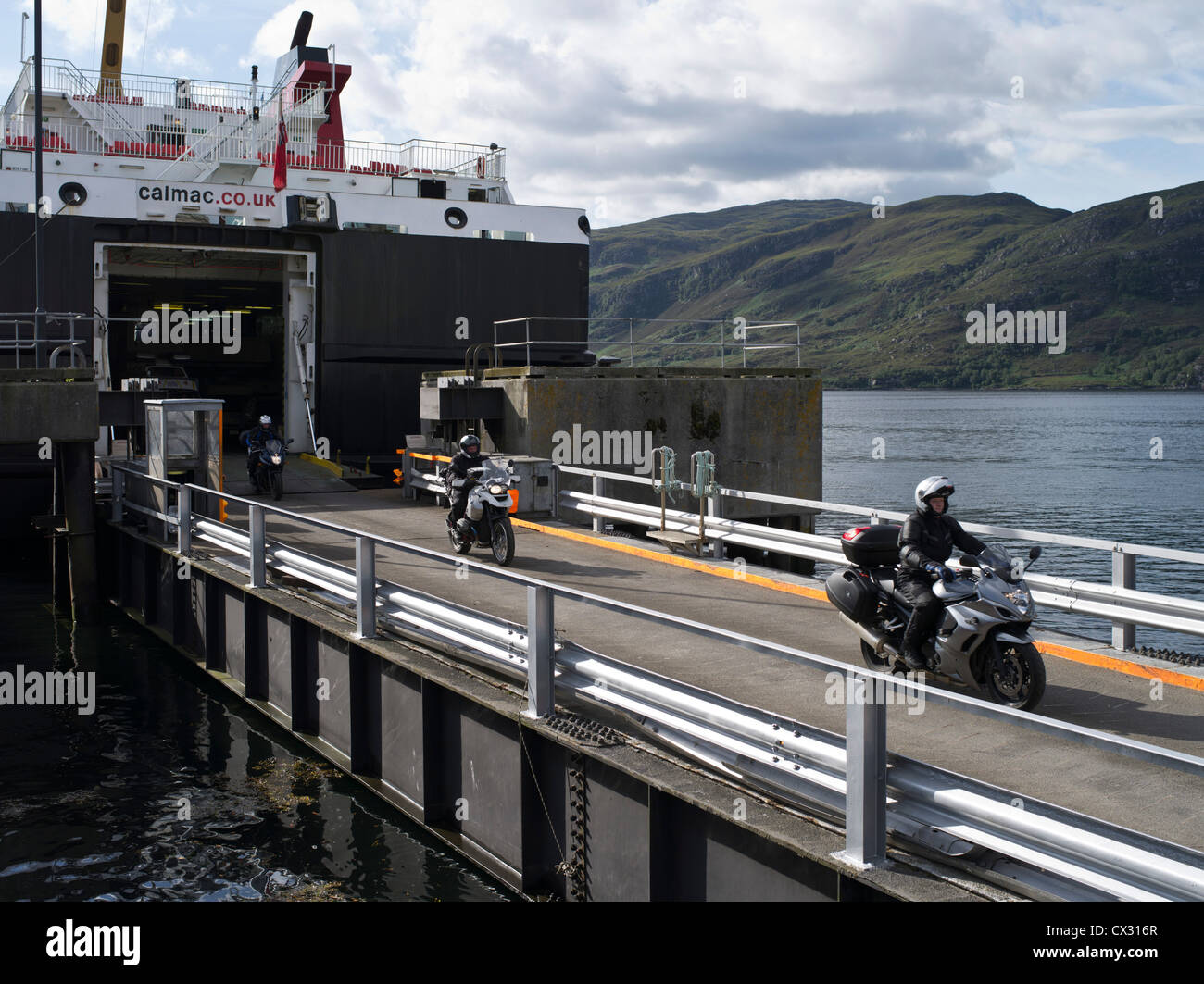 dh ferry ULLAPOOL ROSS CROMARTY Outer Herbrides ferry Isle of Lewis discharging motor bikes scotland people scottish highlands calmac bike ride Stock Photo