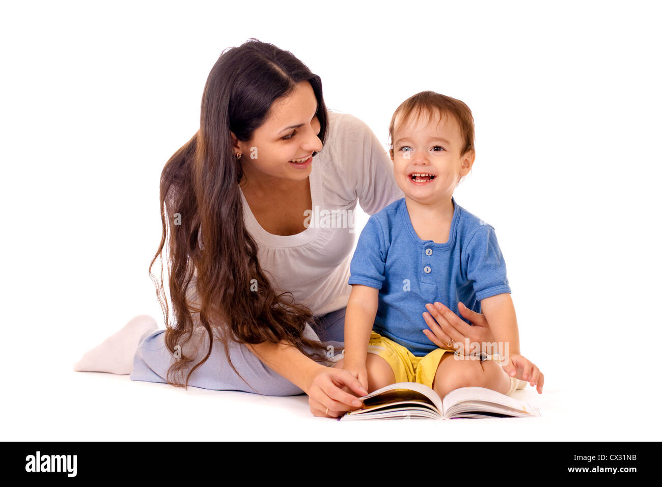Mother and son reading book together isolated on white Stock Photo