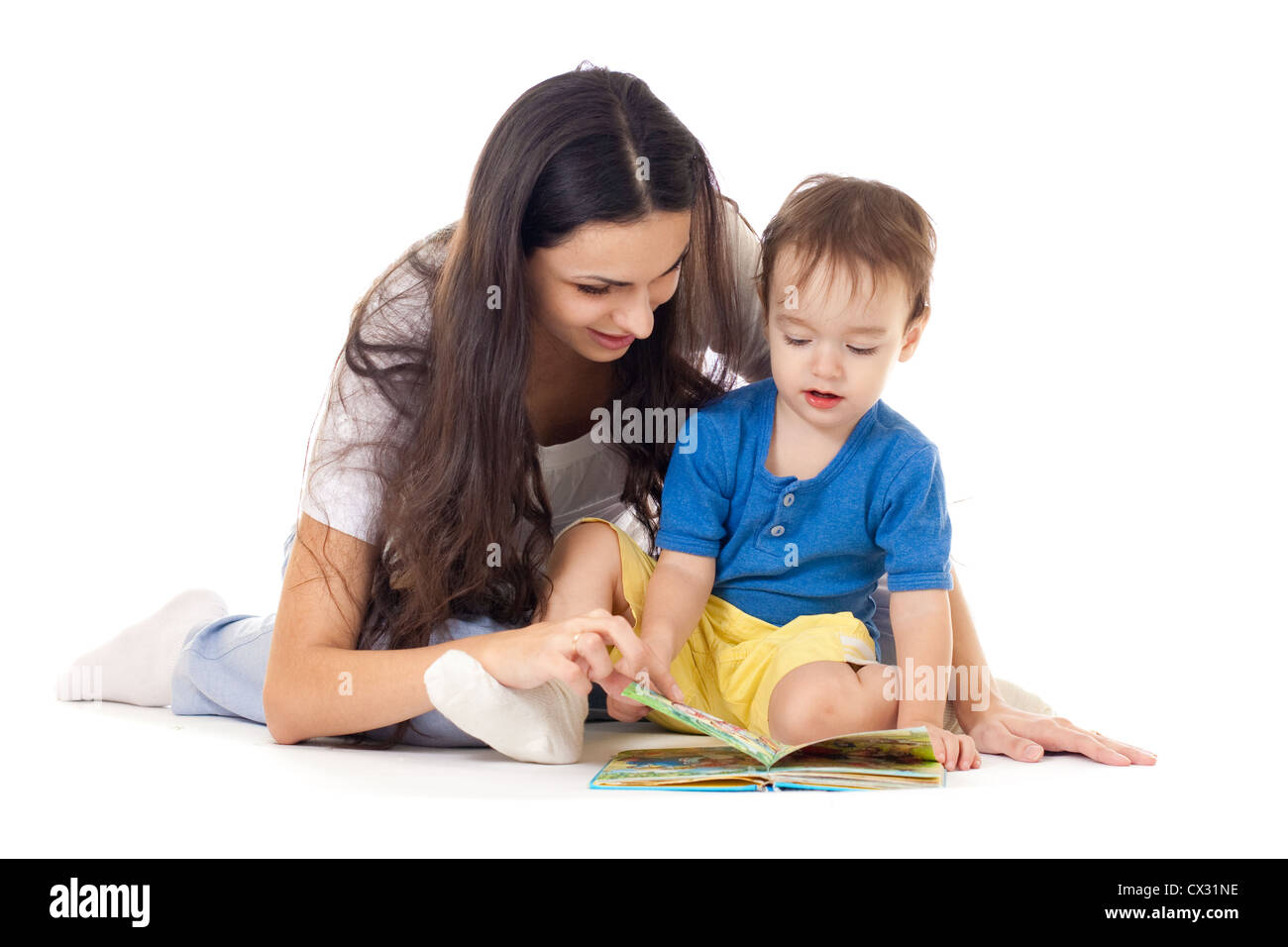 Mother and son reading book together isolated on white Stock Photo