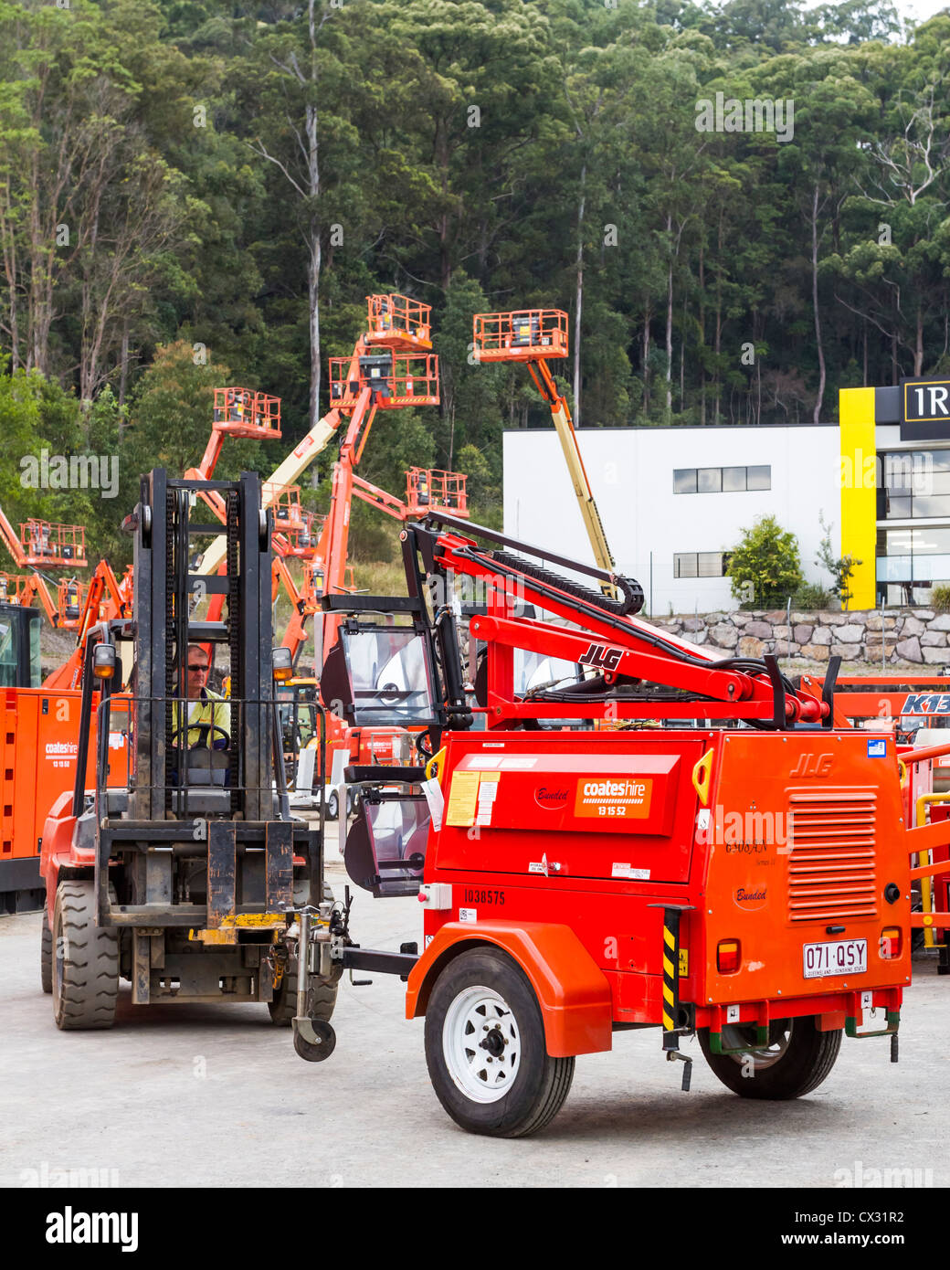 Forklift positioning mobile industrial lighting machinery for hire at Sunshine Coast, Queensland, Australia Stock Photo