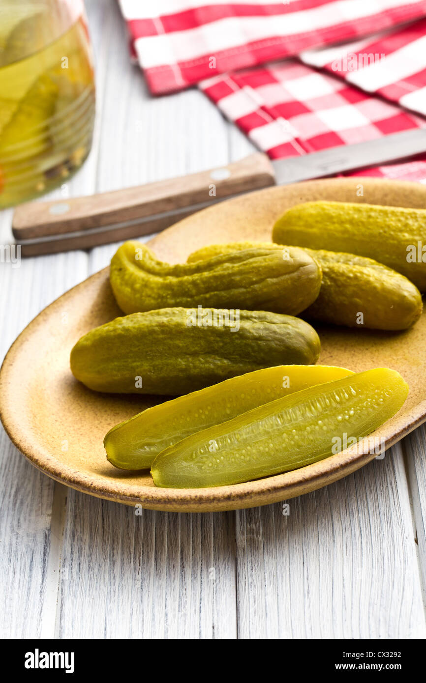 Pickled cucumbers on kitchen table Stock Photo