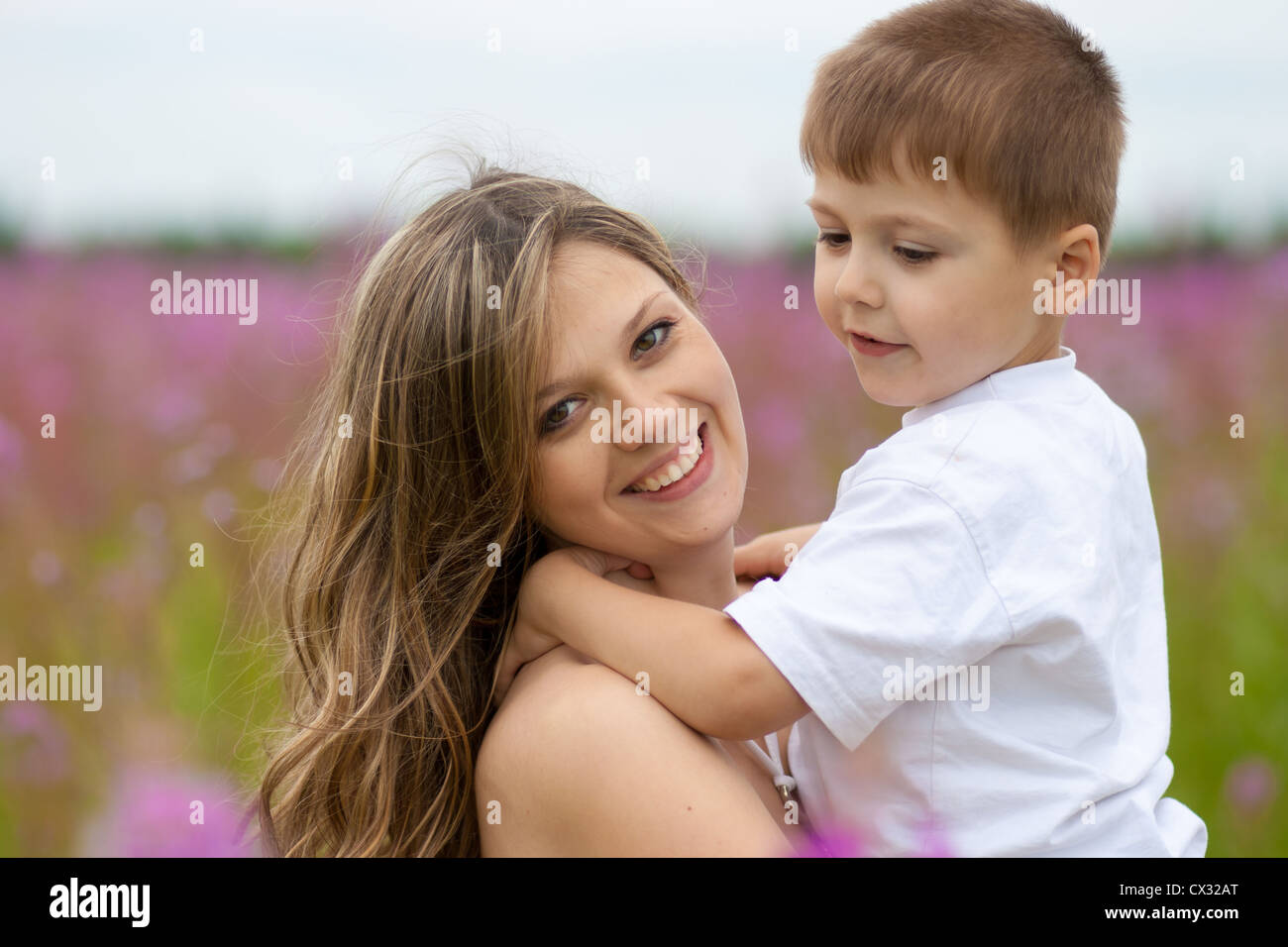 Mother and son in meadow outdoor Stock Photo