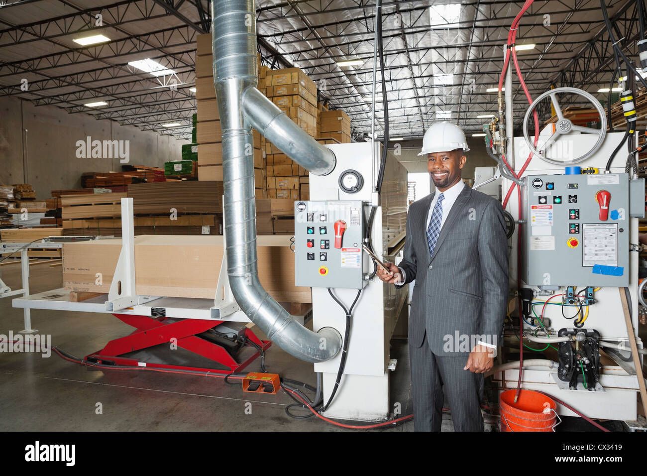 Portrait of an African American male engineer in timber factory Stock Photo