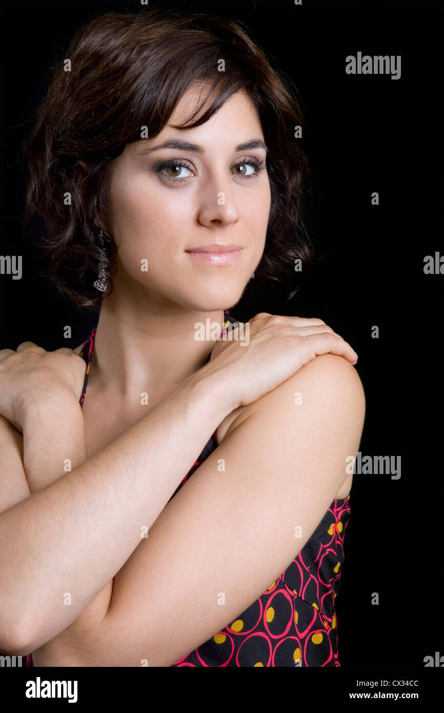 young beautiful brunette portrait against black background Stock Photo ...