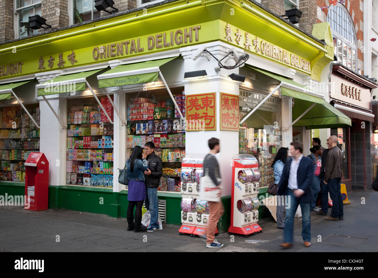 People outside Oriental Delight Shop, Soho, China Town, London, England