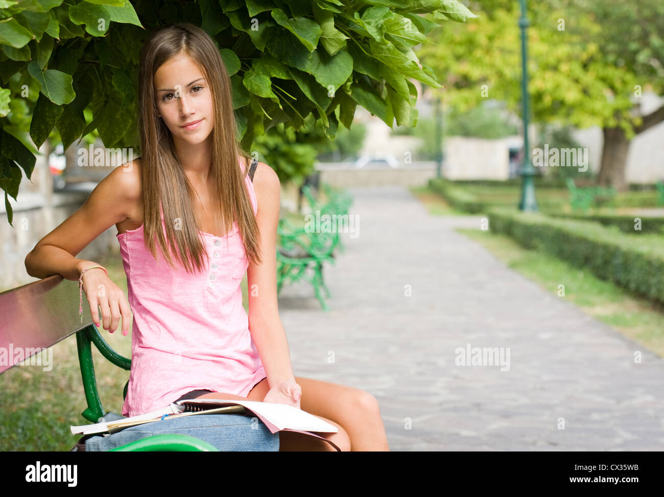 Portrait of a beautiful young student girl preparing outdoors Stock ...