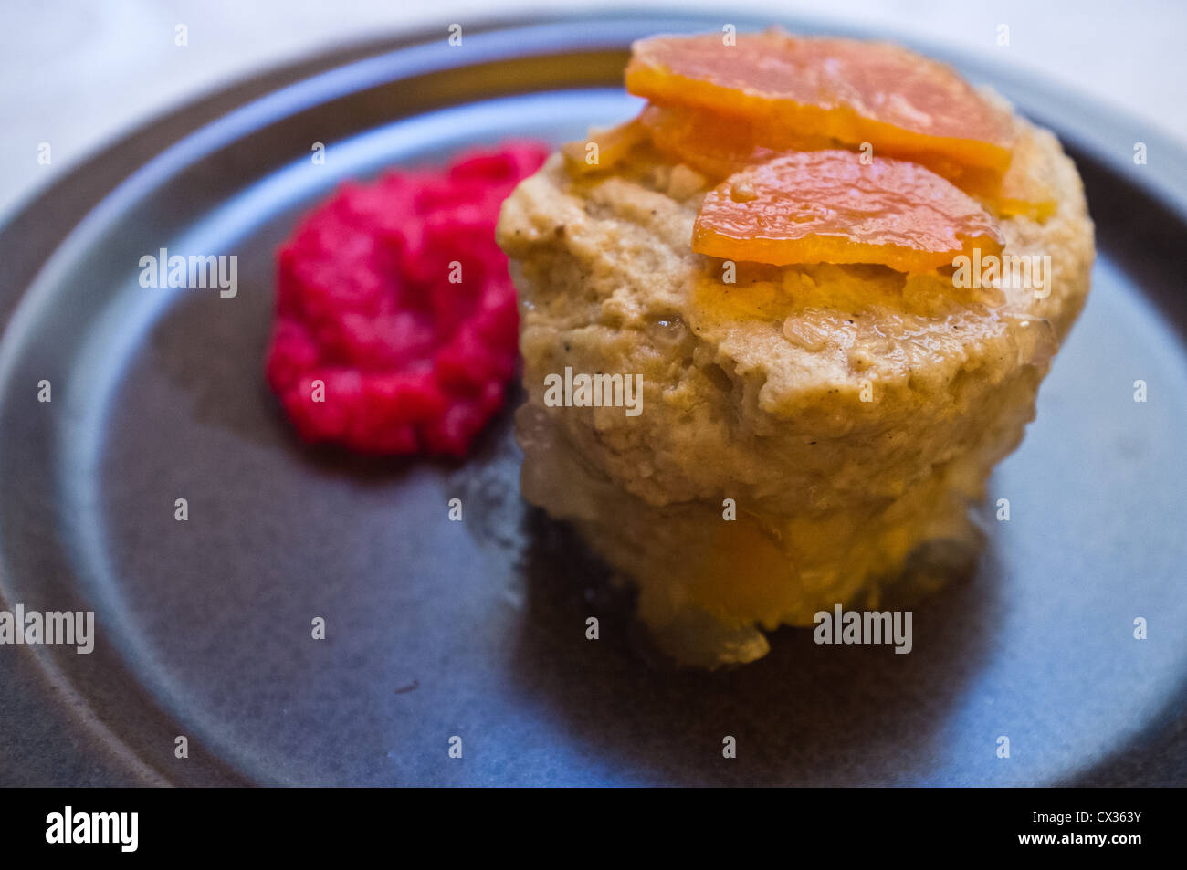 Gefilte Fish patties are traditional Jewish cuisine made of ground carp and served with carrots and horseradish. Stock Photo