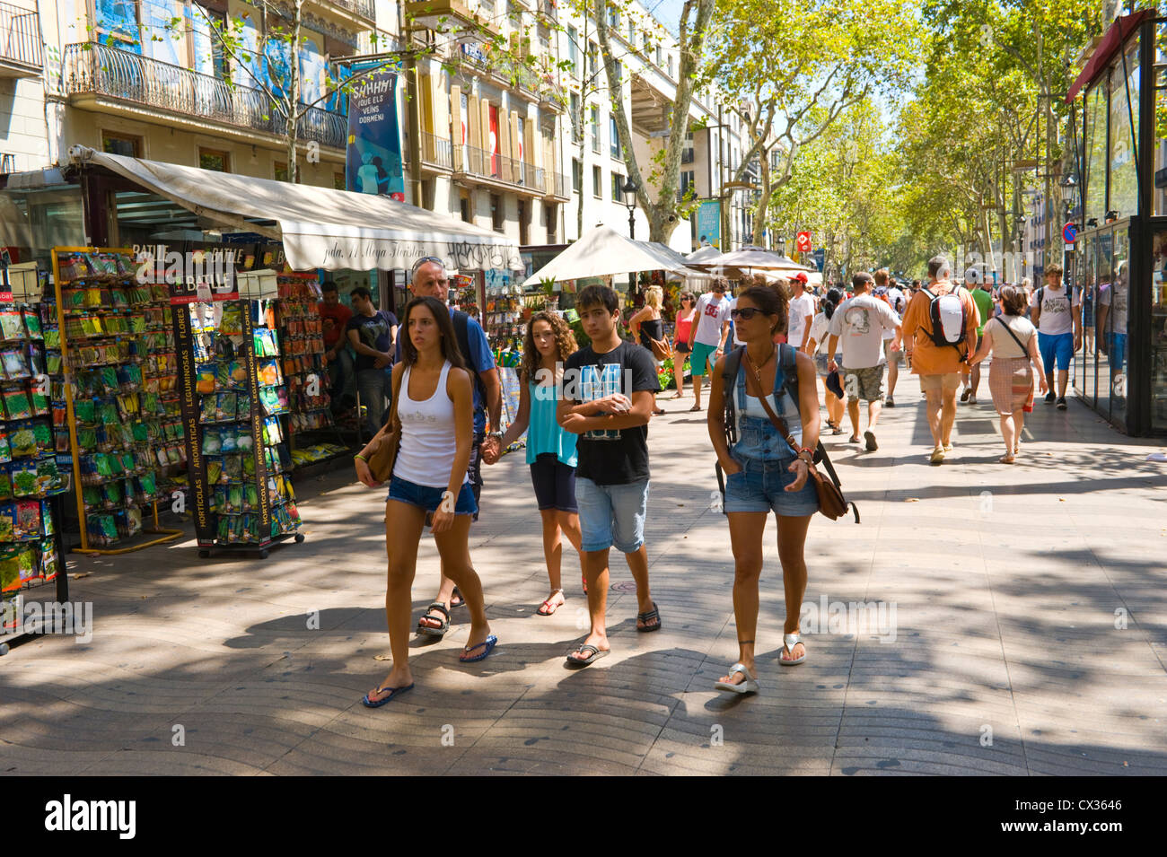 Barcelona ramblas people. Tourists walking down Las Ramblas Barcelona Catalonia Spain ES Stock Photo