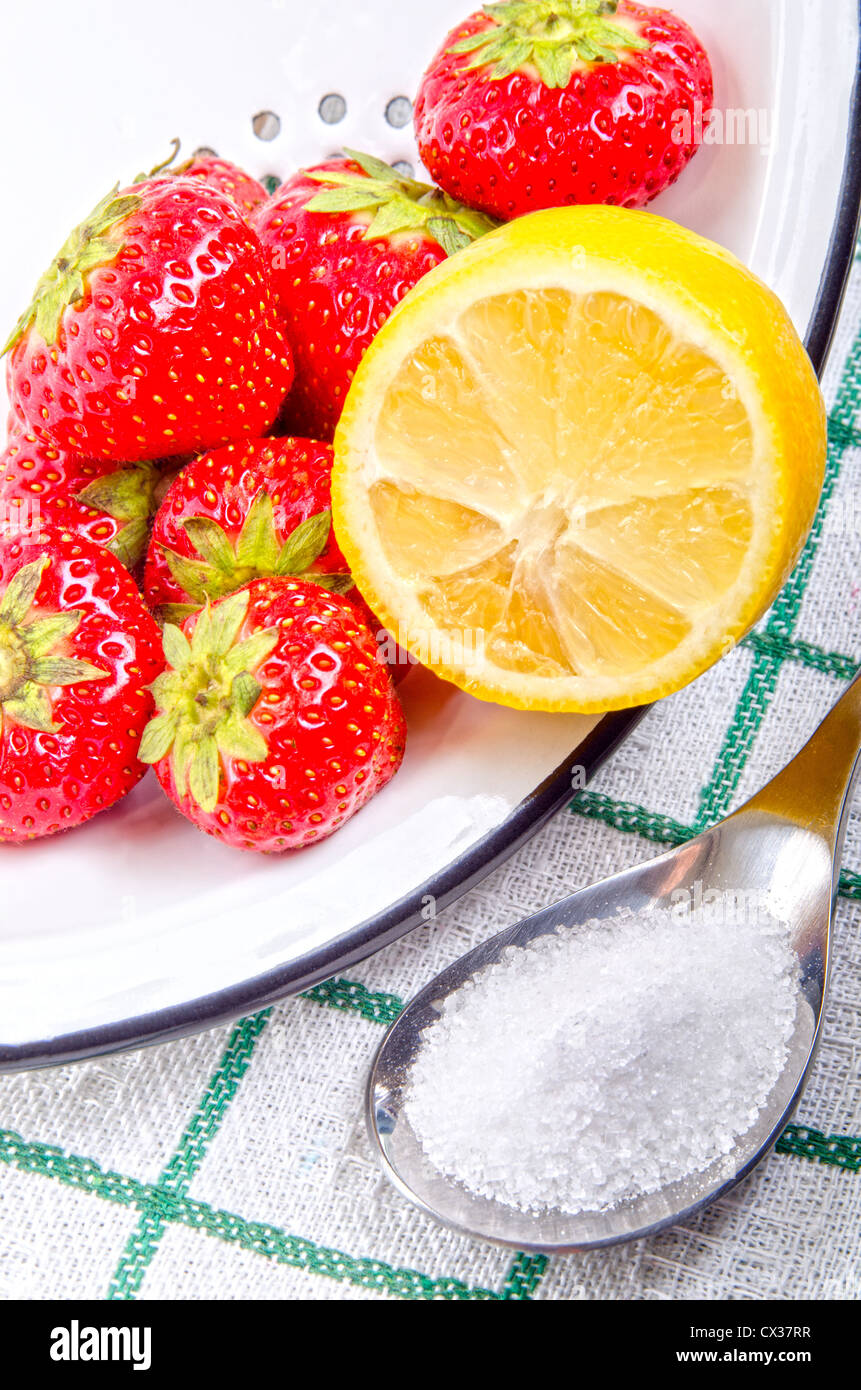 Strawberries with lemon and sugar to make jam Stock Photo Alamy