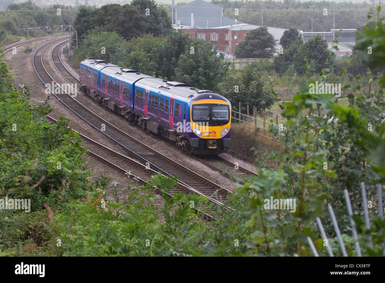 British First Trans Pennine Express train DMU 185 134 heading eastwards through Mirfield en route to Newcastle Stock Photo
