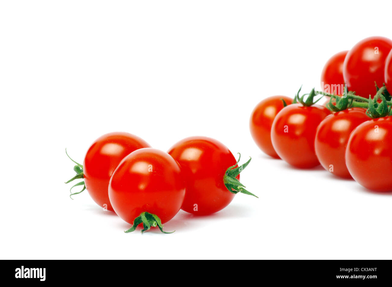 Cherry tomatoes isolated on white Stock Photo - Alamy