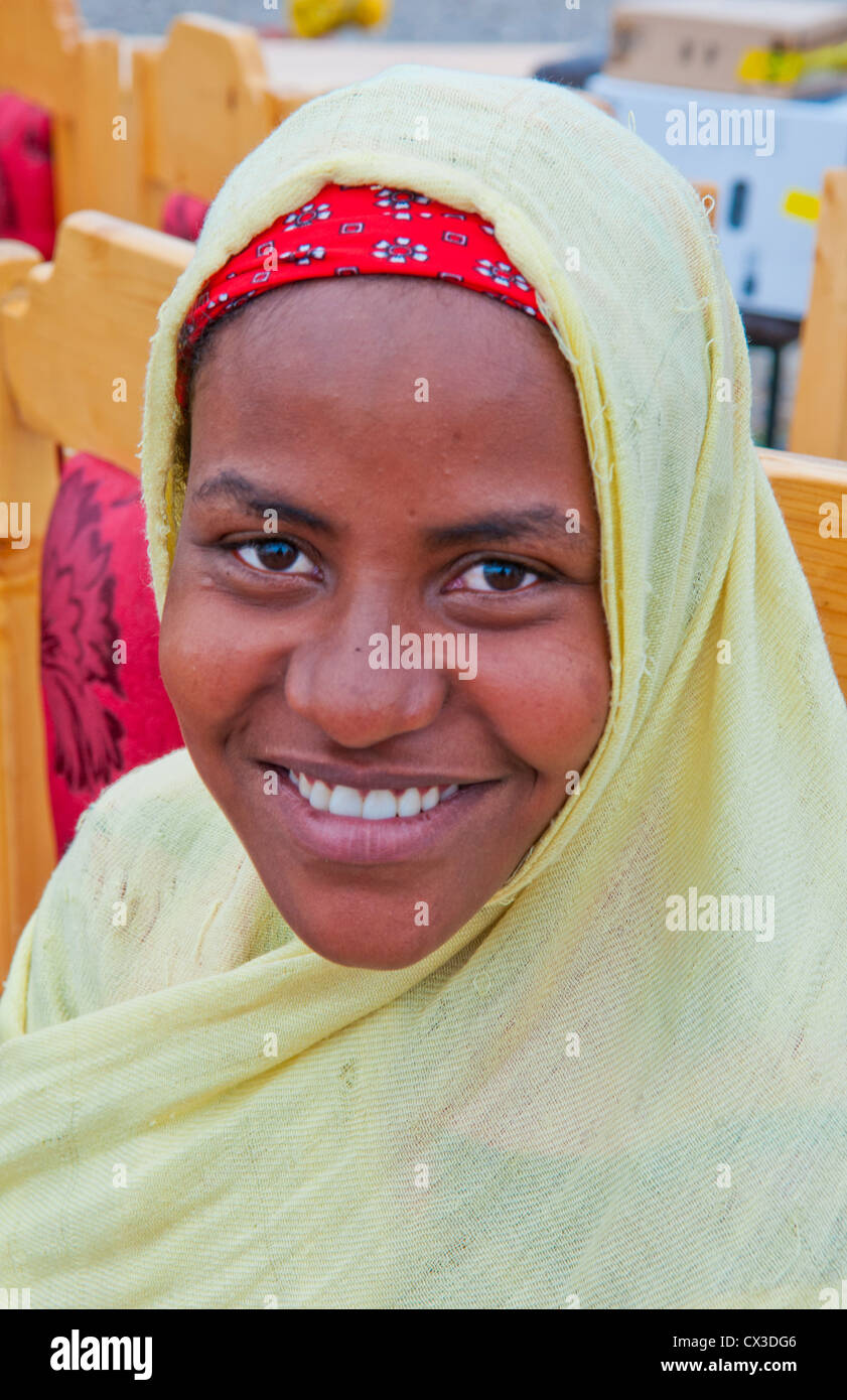 Lake Langano Ethiopia Africa Oromo Tribe young Muslim girl with scarf portrait in front of boat on lake #7 Stock Photo