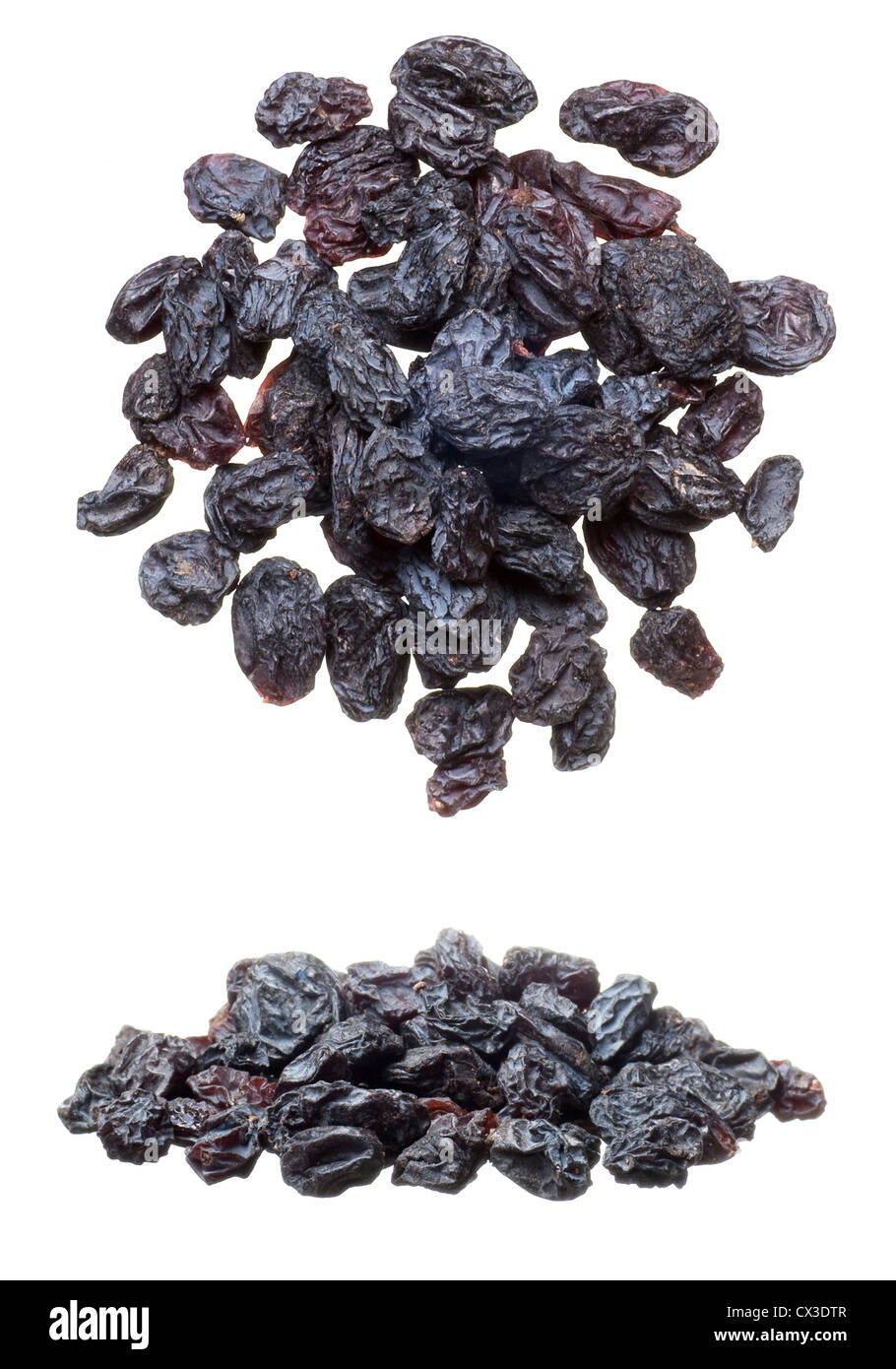 Closeup of black raisins heap isolated on white Stock Photo - Alamy