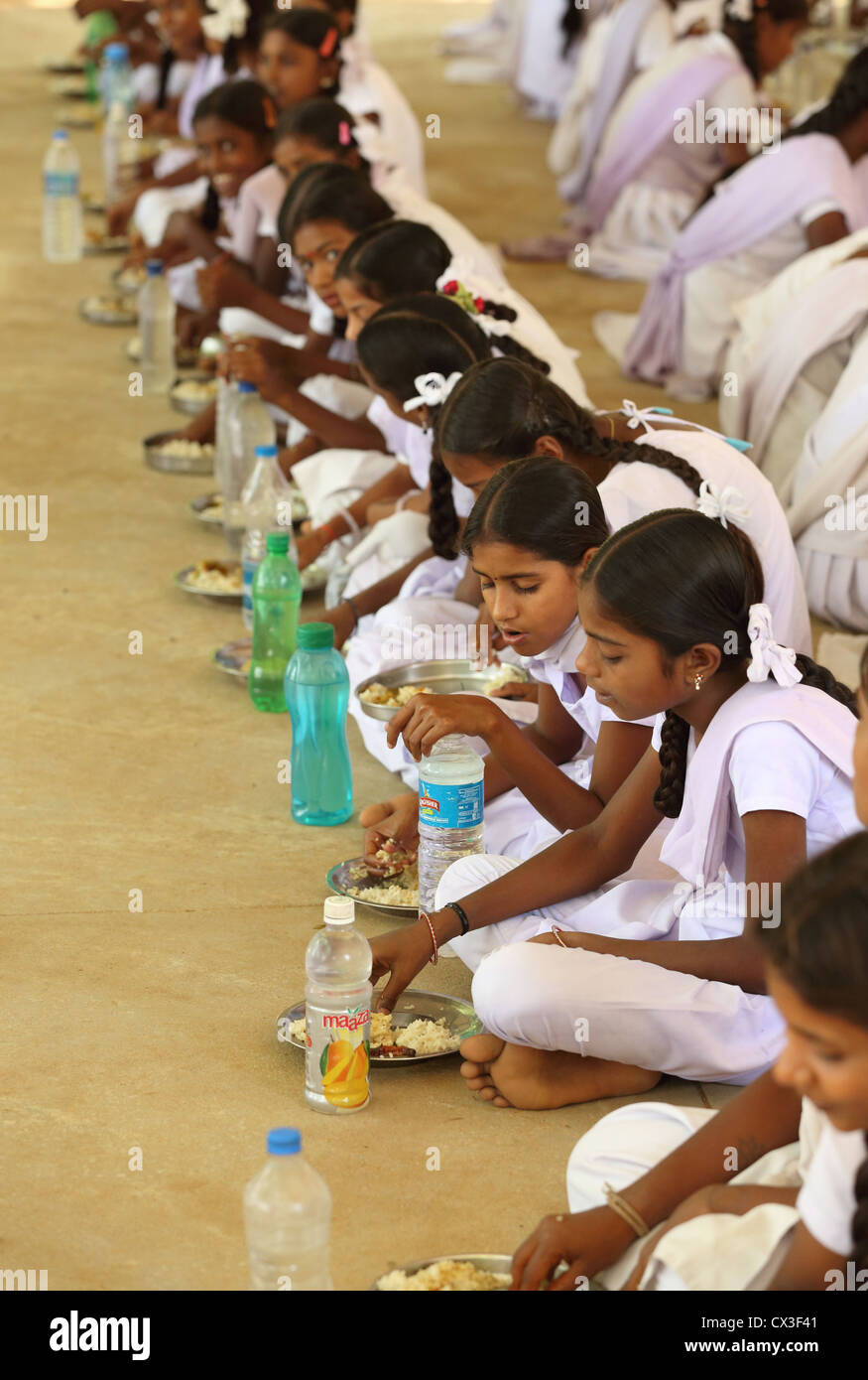 School children having lunch break Andhra Pradesh South India Stock