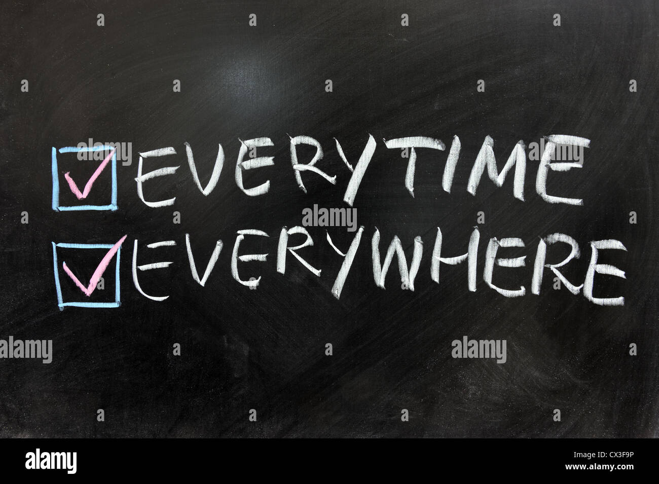 Check box of everytime and everywhere on chalkboard Stock Photo