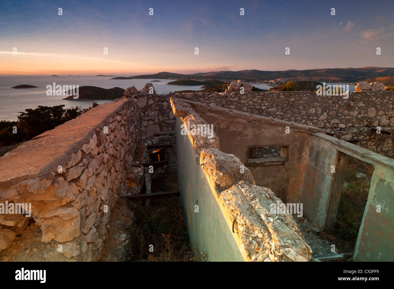 Sunset in Croatia. View of Croatian coast over ruins of old fort in Razanj Stock Photo