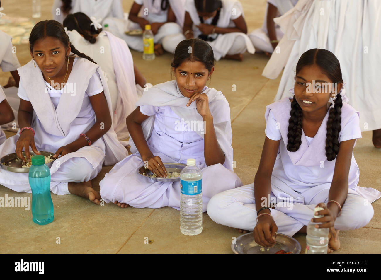 School children having lunch break Andhra Pradesh South India Stock Photo