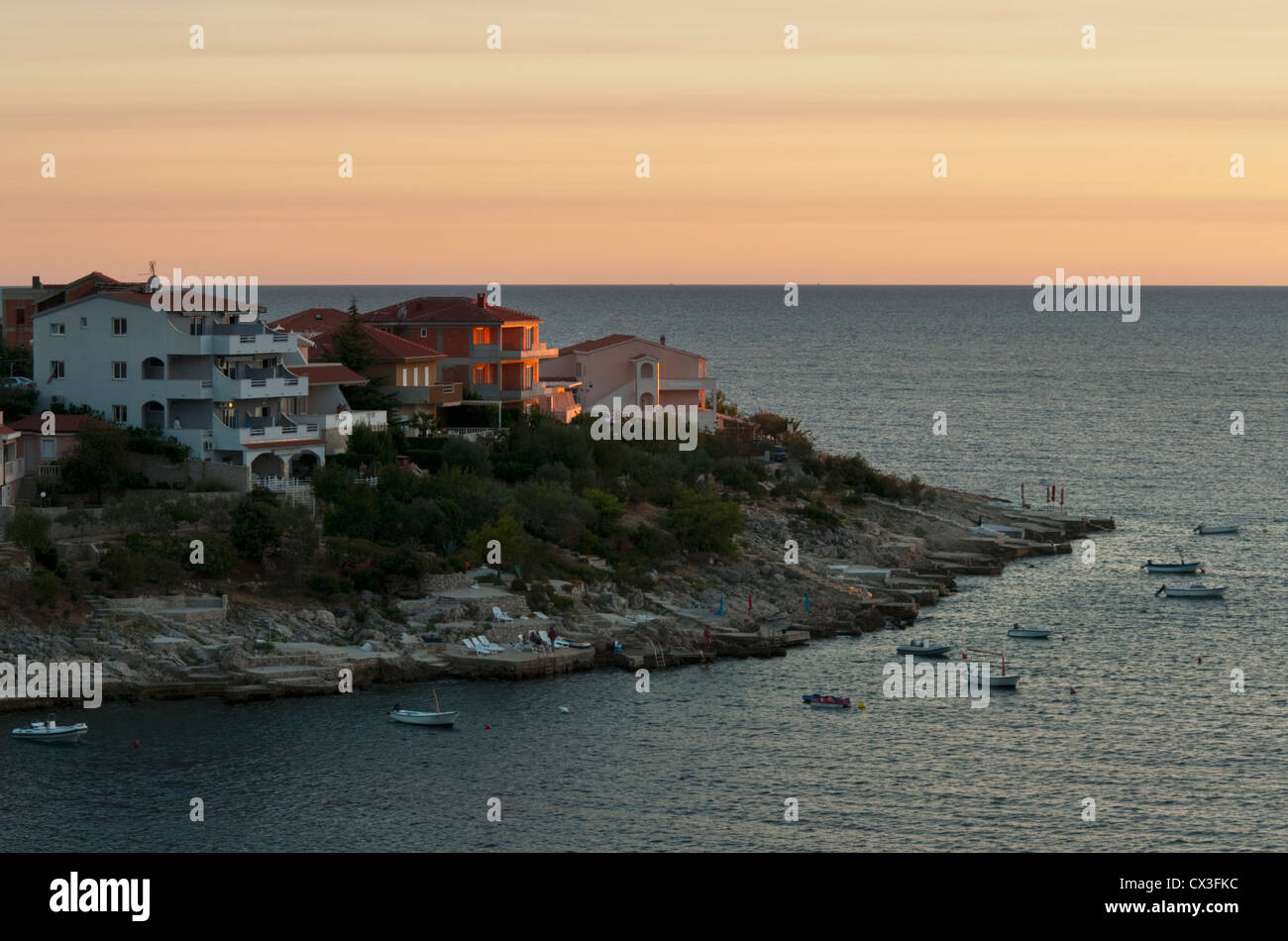 Croatia. Sunset over Adriatic with a view on peninsula with houses Stock Photo
