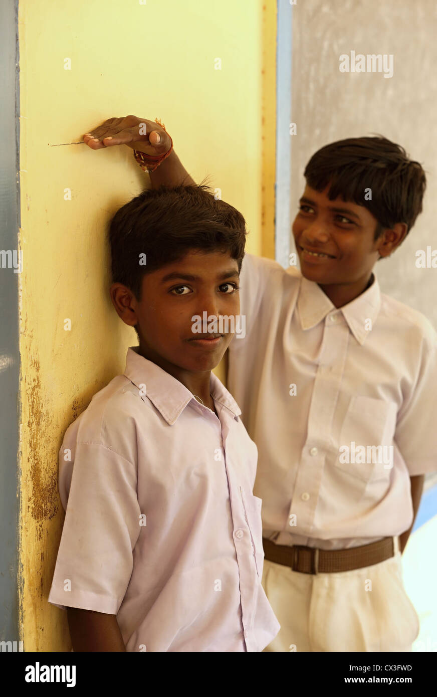 School children measuring their height Andhra Pradesh South India Stock Photo