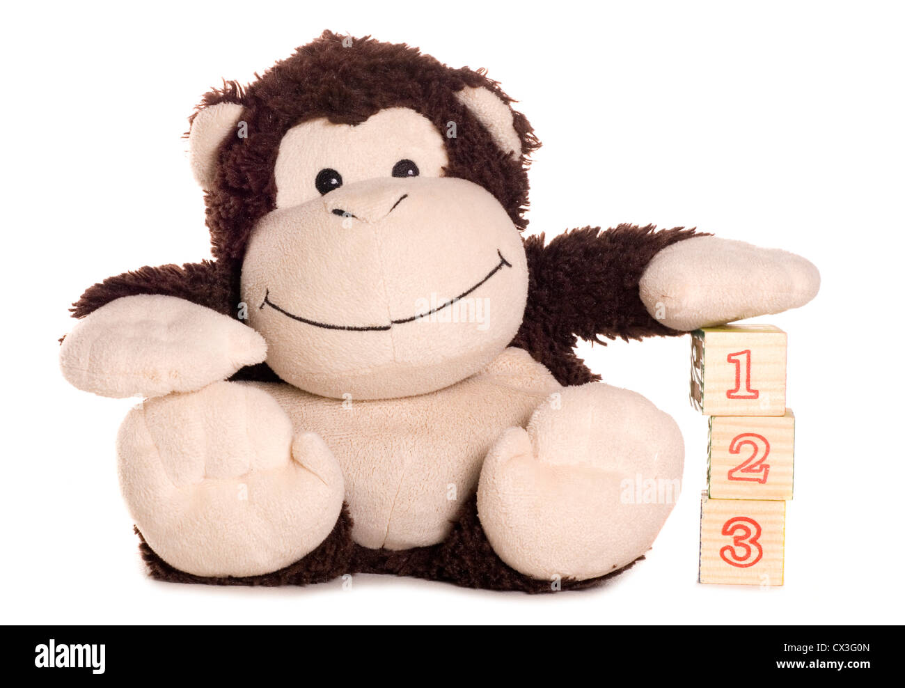 Monkey soft toy learning to count studio cutout Stock Photo