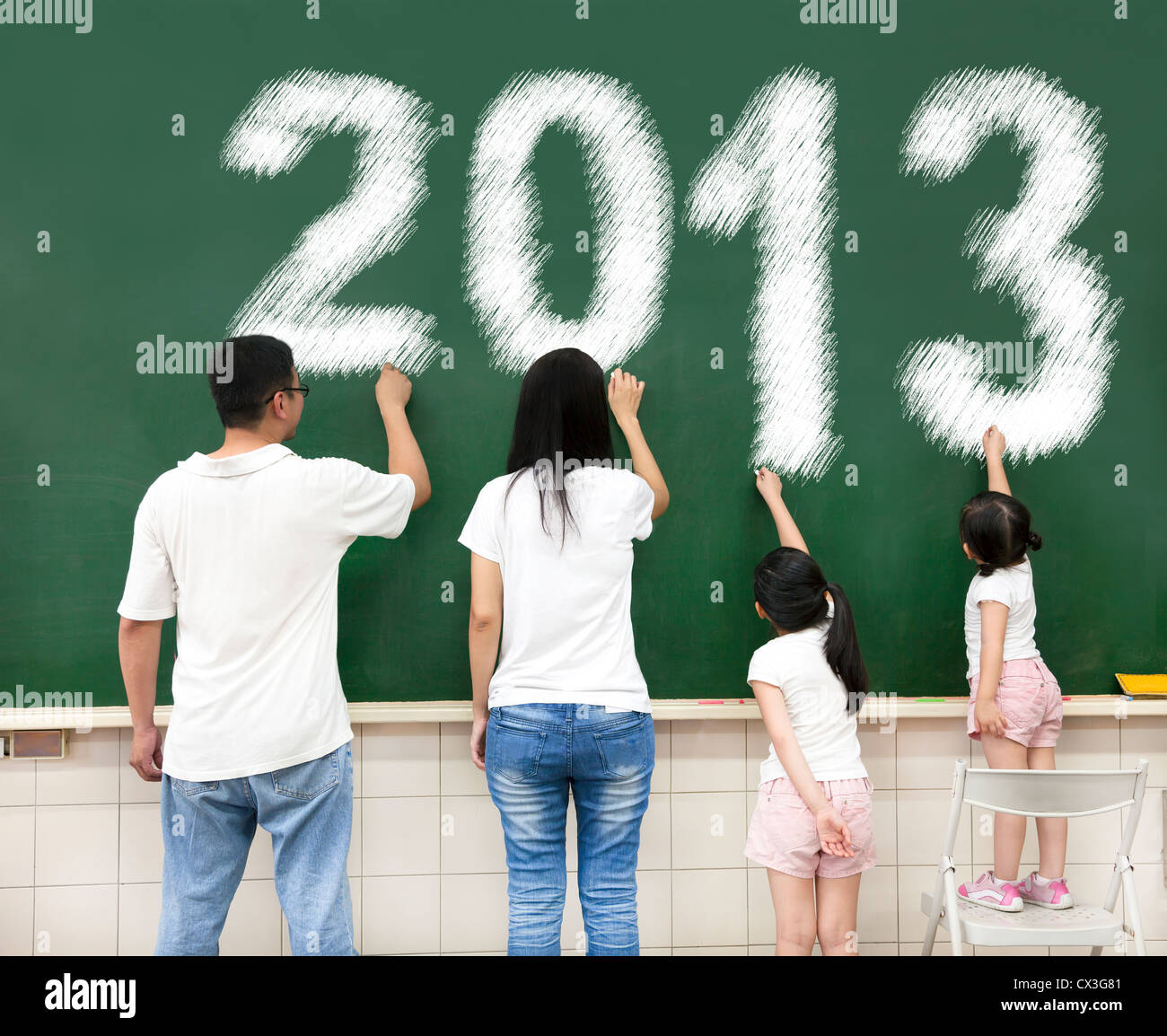 happy family drawing 2013 on the chalkboard Stock Photo