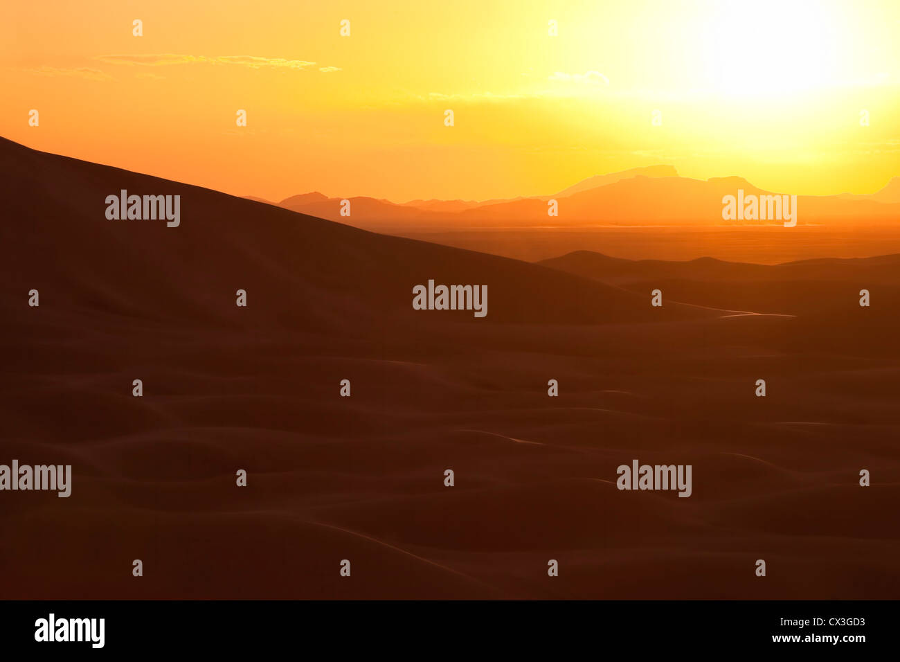 Sunset with dunes in the Sahara desert, Morocco. Stock Photo