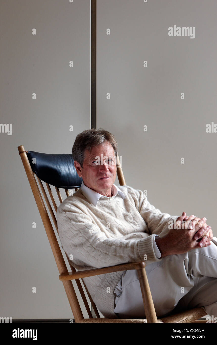 John Pawson at home, London, United Kingdom. Architect: John Pawson, 2010. Portrait of Architect John Pawson, leaning back on a Stock Photo