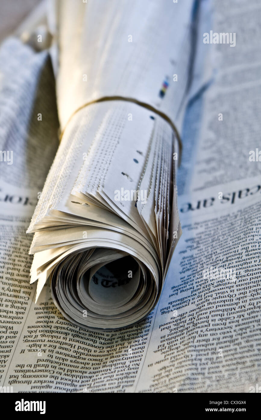 Photo of a rolled up newspaper Stock Photo Alamy