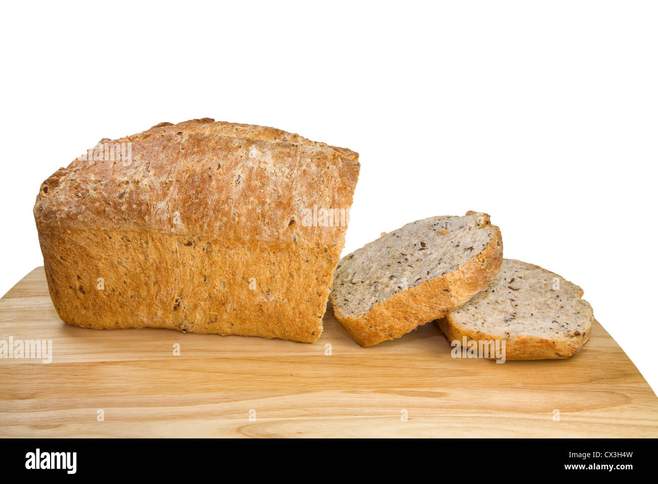 Homemade multigrain bread sliced on a wooden cutting board. Stock Photo