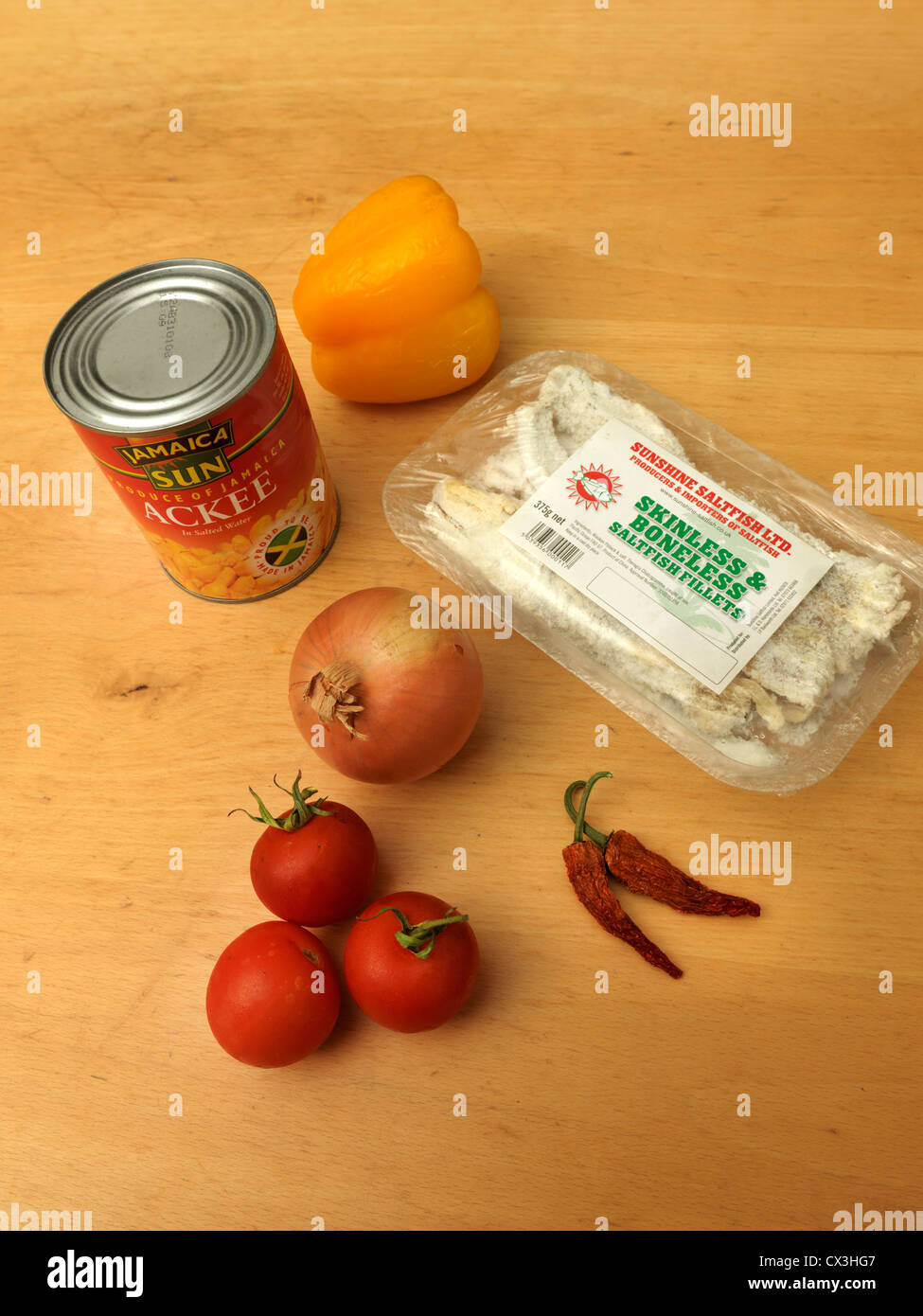 Ingredients For Making Jamaica's National Dish Ackee And Saltfish - Tomatoes, Yellow Pepper, Onion And Chilli Peppers Stock Photo