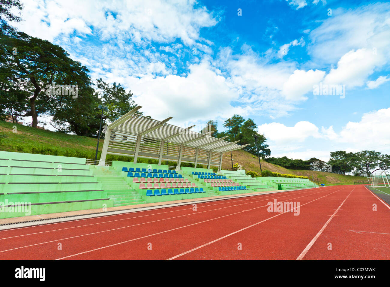 Stadium chairs and running track in a sports ground Stock Photo