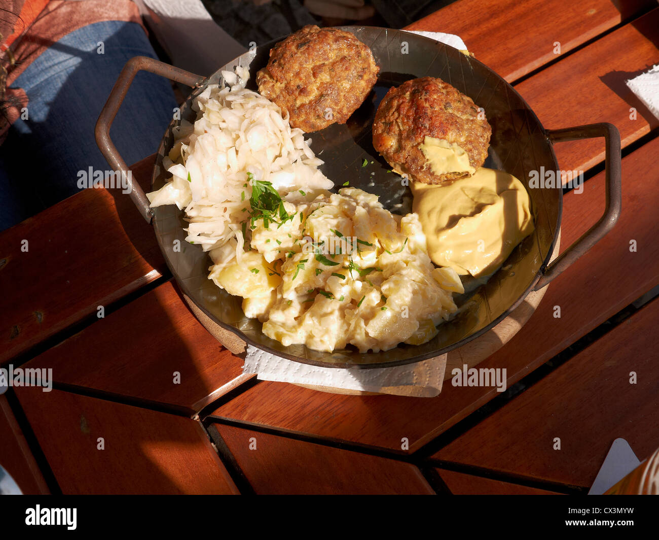 Typical German tasty dish,meatball with potato salad and cabbage salad Stock Photo