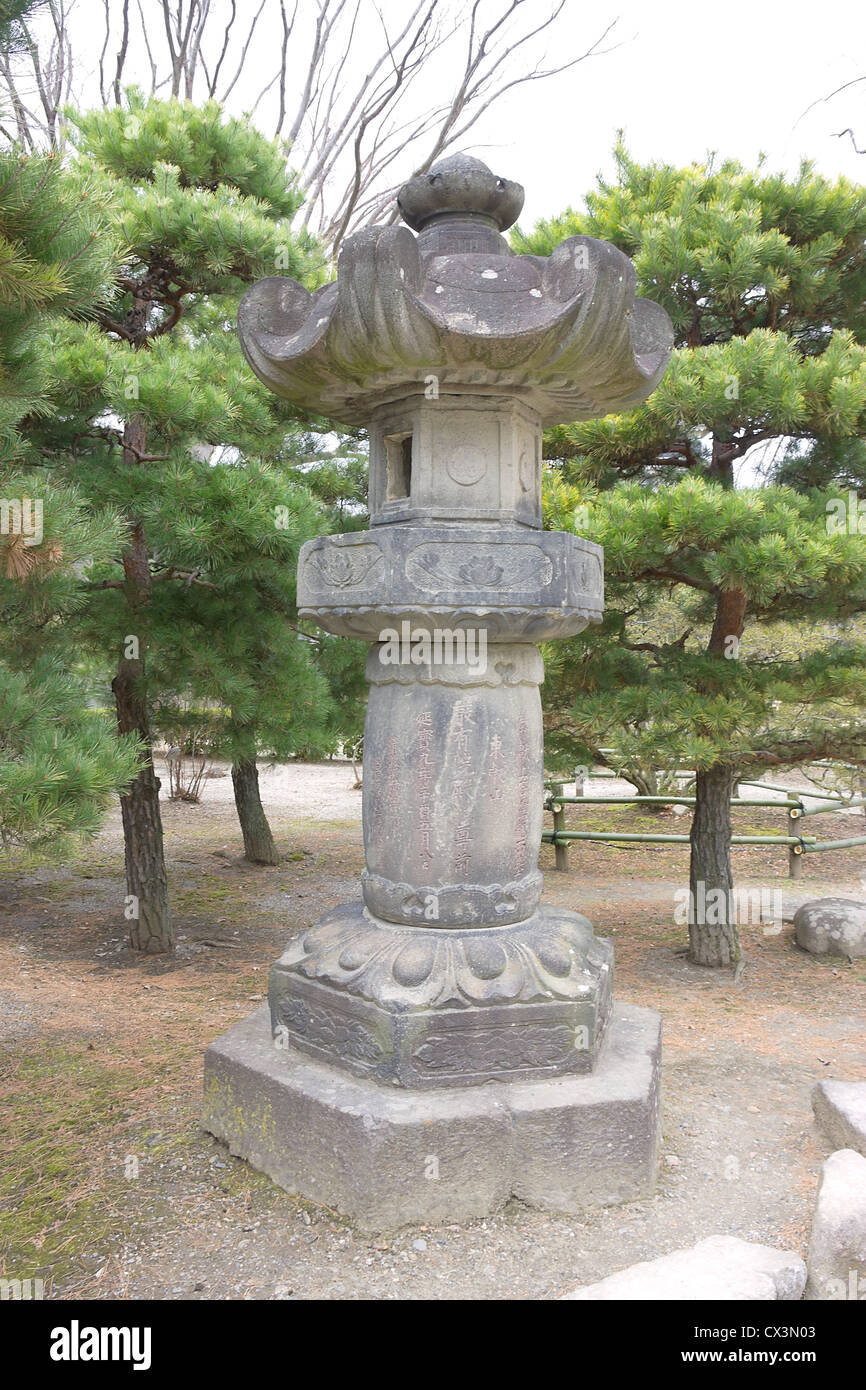Traditional Japanese stone lantern (toro) in the garden of Matsumoto