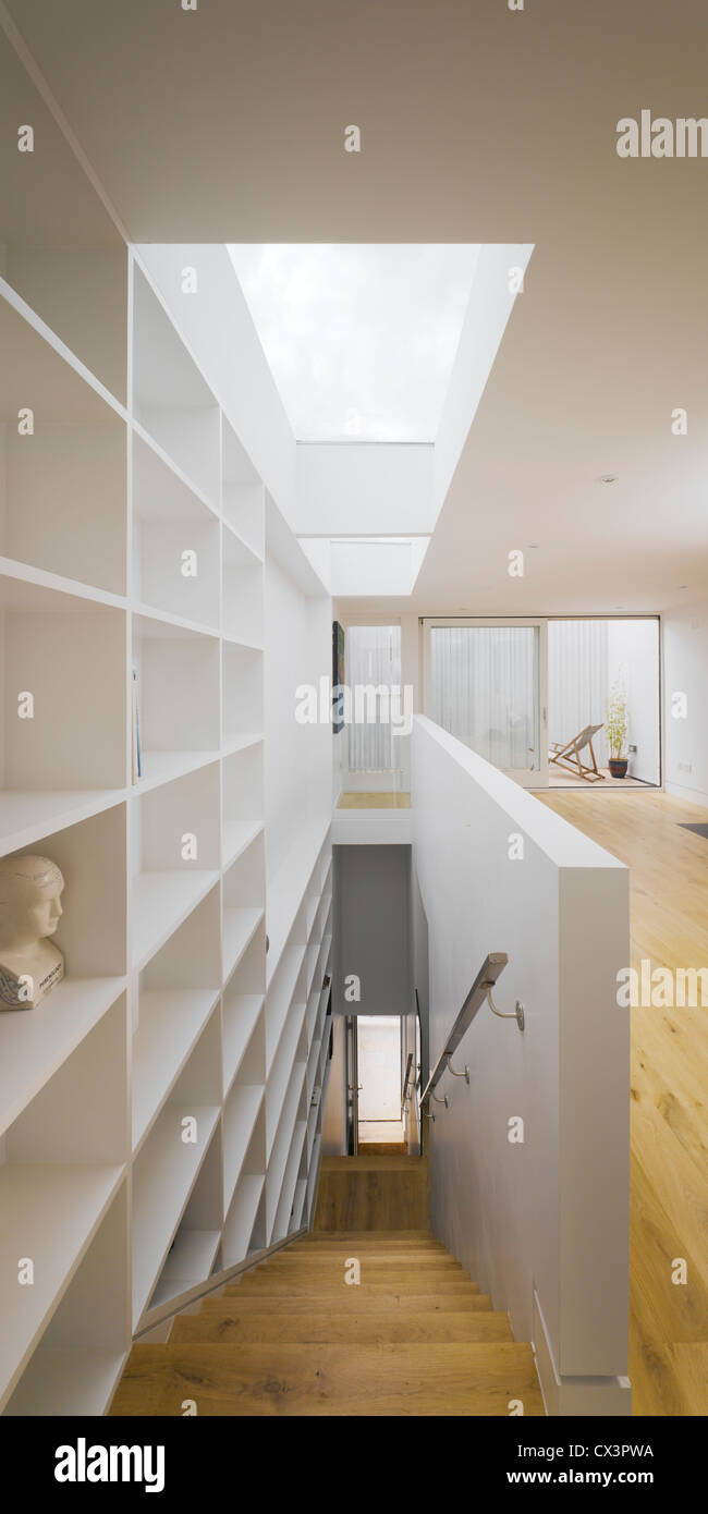 Private Residence Grangegorman, Dublin 7, Ireland. Architect: ODOS Architects, 2009. View of stairs in living space showing fron Stock Photo
