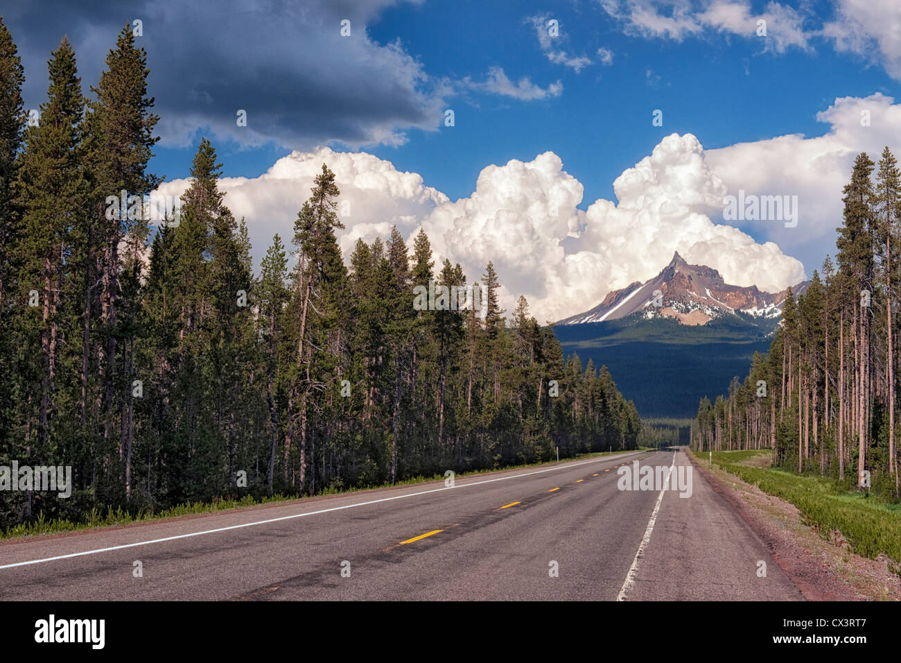 The Rogue Umpqua Scenic Byway offers outstanding views of southern Oregon’s Mt Thielsen as afternoon thunderheads pass overhead. Stock Photo