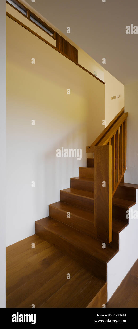 Gray House, Howth, Ireland. Architect: O'Donnell & Tuomey, 2008. View of stairs showing timber flooring. Stock Photo