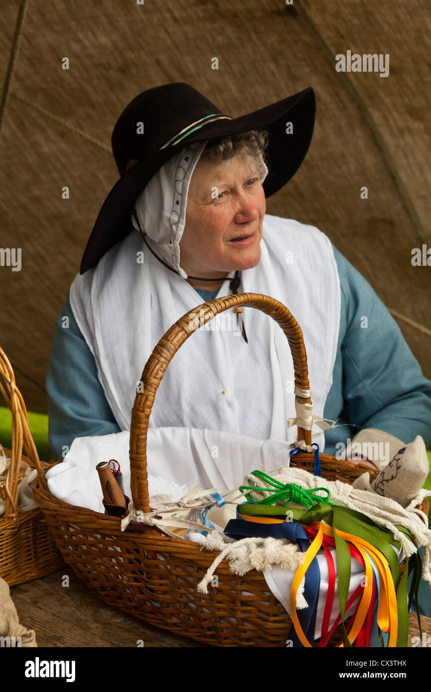 17th century woman with her basket of fabrics Stock Photo - Alamy