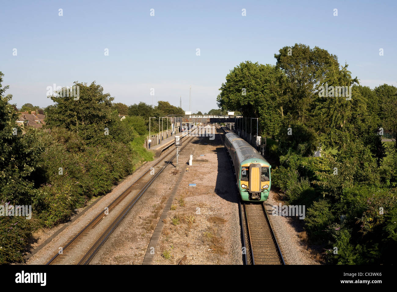 Havant railway station with class 377 electrostar in Southern livery en route to Portsmouth on a warm August afternoon Stock Photo